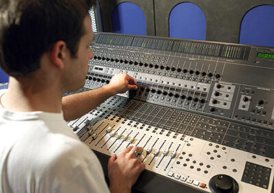 Young Man Running Professional Sound Board